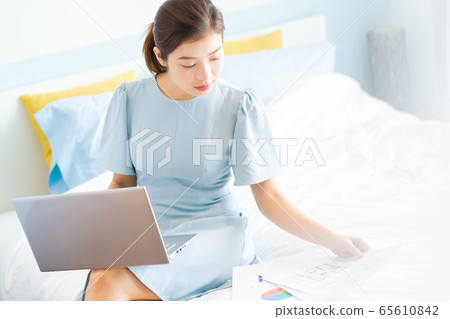 Beautiful woman, working at home Beautiful woman, working at home 65610842