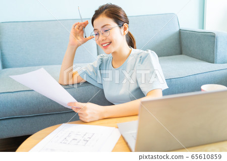 Beautiful woman, working at home Beautiful woman, working at home 65610859