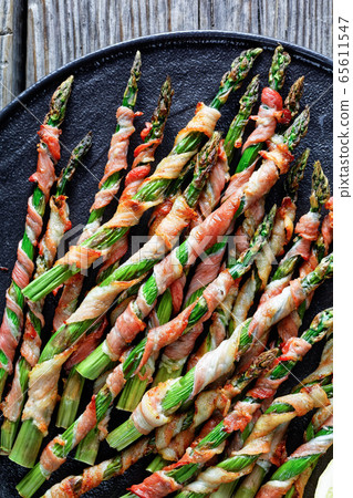 Low carb dish bacon wrapped asparagus, flat lay 65611547