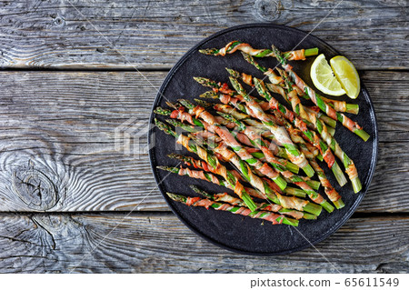 Bacon wrapped asparagus easy side dish, copy space Bacon wrapped asparagus easy side dish, copy space 65611549