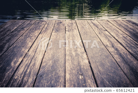 Vintage wooden boards with forest lake background Vintage wooden boards with forest lake background 65612421