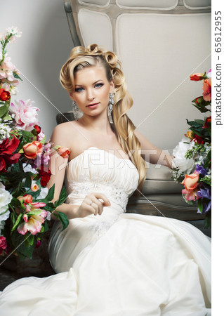 beauty young bride alone in luxury vintage interior with a lot of flowers, makeup and creative hairstyle beauty young bride alone in luxury vintage interior with a lot of flowers, makeup and creative hairstyle 65612955