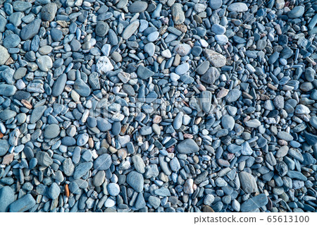 Blue pebbles. Background from a natural stone of blue, turquoise hue. Pebbles texture Blue pebbles. Background from a natural stone of blue, turquoise hue. Pebbles texture 65613100
