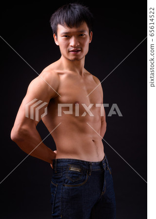 Portrait of young muscular Asian man shirtless Portrait of young muscular Asian man shirtless 65614522