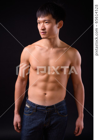 Portrait of young muscular Asian man shirtless 65614528