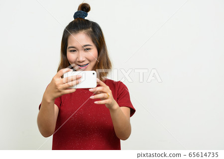 Portrait of young Asian woman with short hair Portrait of young Asian woman with short hair 65614735