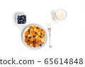 Trendy pancake cereal meal with blueberries and milk on white background. Tiny baked pancakes. Breakfast food. 65614848