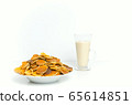 Trendy pancake cereal meal with milk on white background. Tiny baked pancakes. Breakfast food. 65614851