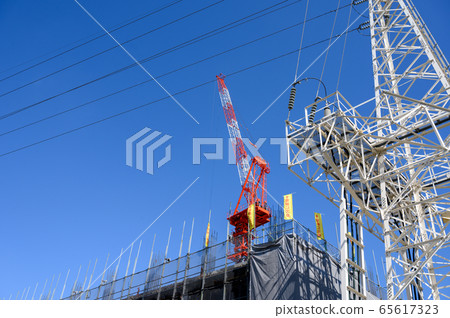 Crane high voltage electric wire on construction site 65617323