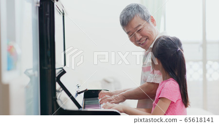 grandpa teach girl play piano 65618141