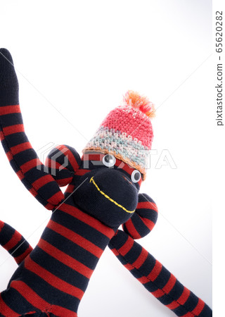 White background sock monkey 65620282