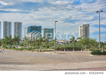 Cancun city landscape with palm trees in windy weather. Mexica. Cancun city landscape with palm trees in windy weather. Mexica. 65620448