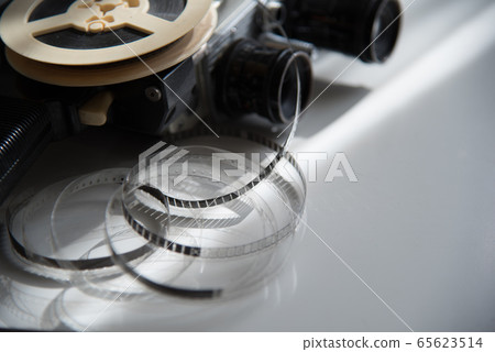 Film roll of film on a reel with a retro movie 65623514