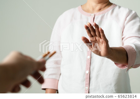Quit smoking, no tobacco day, mother hands gesture reject proposal the cigarette 65623814