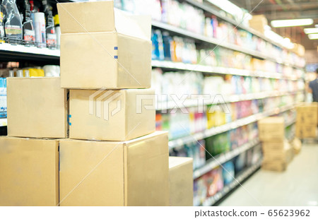 Empty carton in the stainless trolley at Supermarket aisle preparing for arrange put on the shelves for customer to buy for hoarding food 65623962