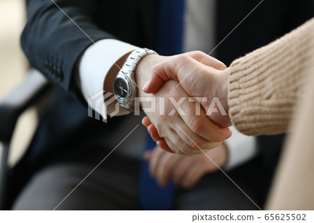 Female in beige sweater 65625502