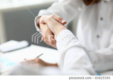 Witty corporation handshake Witty corporation handshake 65625585