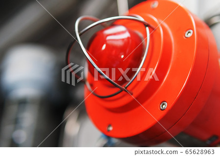 Red warning light of an emergency beacon at an Red warning light of an emergency beacon at an 65628963