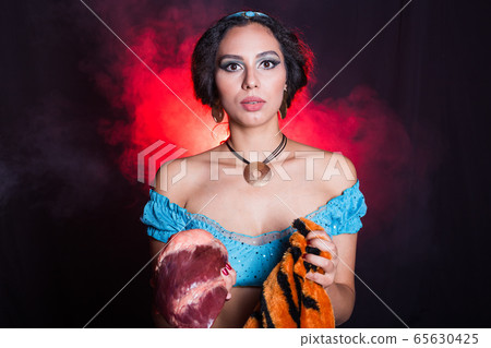 Woman calls stop wearing fur. Vegetarian campaign against the fur and meat industry. Eco friendly behaviour. Protect the animals. 65630425