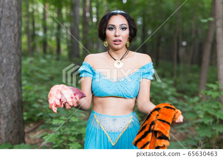 Stop animal killing concept - Pretty girl show animal skin that she wants to tell someone don't kill animals or stopped violence against animal. 65630463
