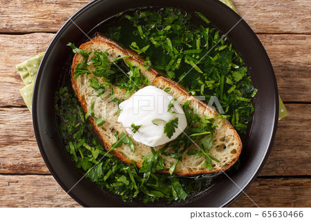 Light portuguese green soup Acorda with poached Light portuguese green soup Acorda with poached 65630466