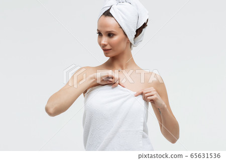 Charming woman with white towel on head Charming woman with white towel on head 65631536