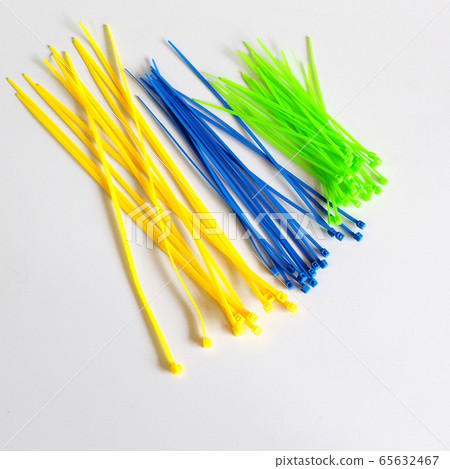 Plastic Cable Ties Colors on background. 65632467