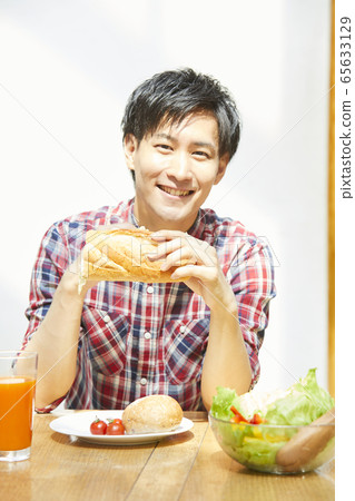 Young men around the table 65633129