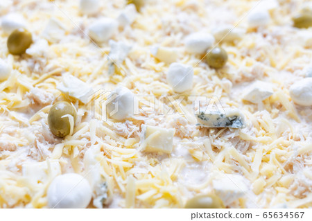 Close up image of cheese pizza ready for baking Close up image of cheese pizza ready for baking 65634567