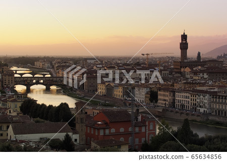 Florence, Italy View of Ponte Vecchio and Arno river from Piazzale Michelangelo Evening Florence Florence, Italy View of Ponte Vecchio and Arno river from Piazzale Michelangelo Evening Florence 65634856