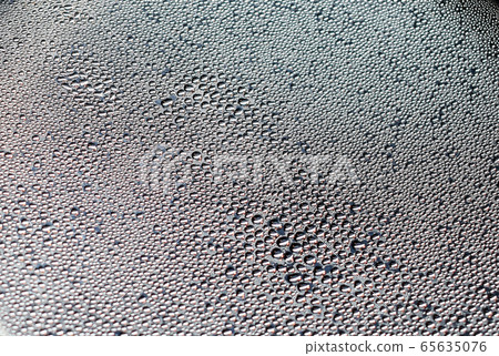 Water droplets were adhering to the metal surface from steam 65635076