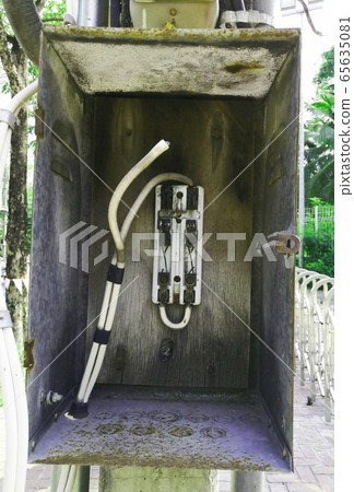 Imperfectly cut-out switch board at public places without cover protect 65635081