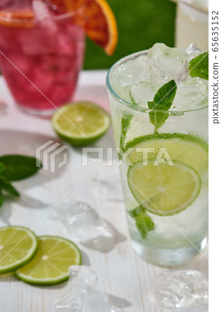 Assorted cocktail, lime, orange and pineapple. Summer concept. Assorted cocktail, lime, orange and pineapple. Summer concept. 65635152
