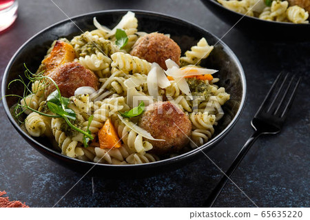 Pasta with meatballs and homemade parsley pesto sauce. Copy space. 65635220