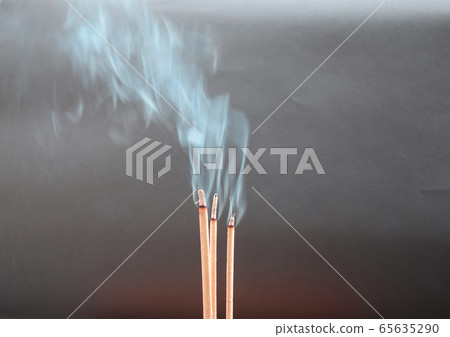 Incense and smoke floating On a gray background Incense and smoke floating On a gray background 65635290
