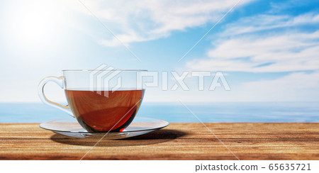 3D illustration of a cup of tea on a brown wooden table with Cloudy sky an sea background. Textured Wallpaper. 65635721