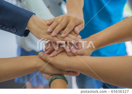 Many handshake of business people join team work out office. This hand of group corporate mix partnership multiple ethnicity. Teamwork is importance for successful of business model. Many handshake of business people join team work out office. This hand of group corporate mix partnership multiple ethnicity. Teamwork is importance for successful of business model. 65636327
