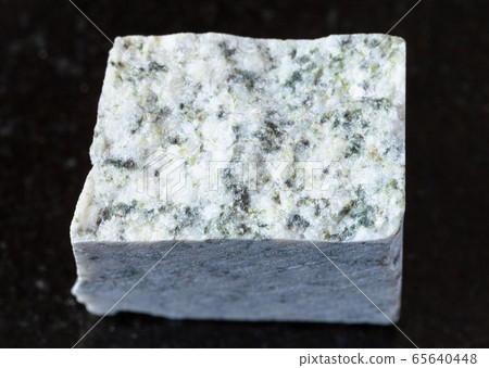 rough white Granite rock on black rough white Granite rock on black 65640448