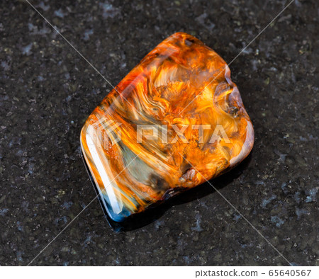 tumbled Pietersite rock on black tumbled Pietersite rock on black 65640567