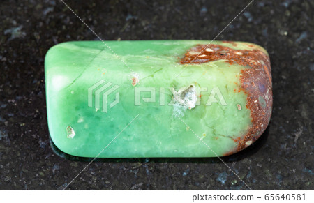 polished Chrysoprase rock on black polished Chrysoprase rock on black 65640581