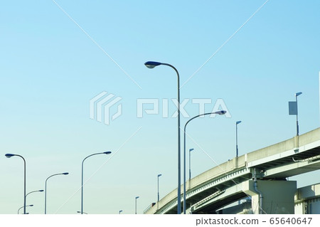 Streetlight and blue sky along the highway Streetlight and blue sky along the highway 65640647
