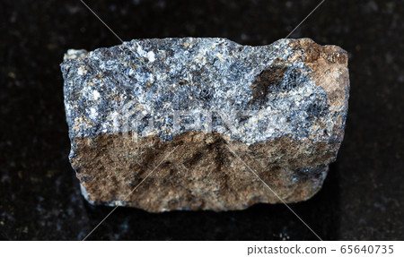 rough Zinc ore (Sphalerite) rock on black rough Zinc ore (Sphalerite) rock on black 65640735