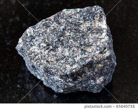 rough Nepheline Syenite rock on black rough Nepheline Syenite rock on black 65640738
