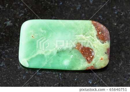 tumbled Chrysoprase rock on black tumbled Chrysoprase rock on black 65640751