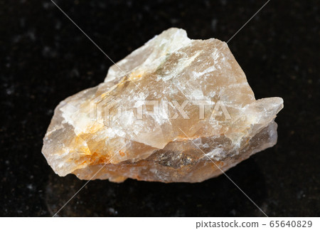 rough Fluorite rock on black 65640829