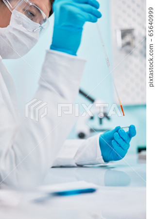 Young woman lab technician with pipette , blurred background. Young woman lab technician with pipette , blurred background. 65640999