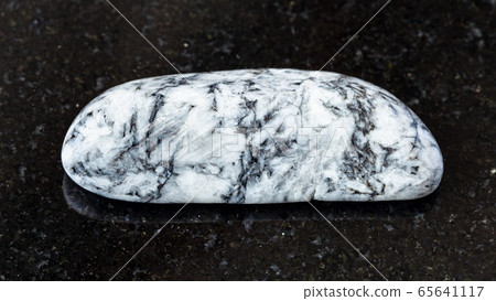 tumbled Magnesite rock on black tumbled Magnesite rock on black 65641117
