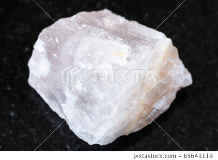 rough pink Fluorite rock on black 65641119
