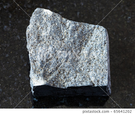 unpolished Gabbro rock on black unpolished Gabbro rock on black 65641202