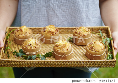 Woman with handmade muffins Woman with handmade muffins 65641421